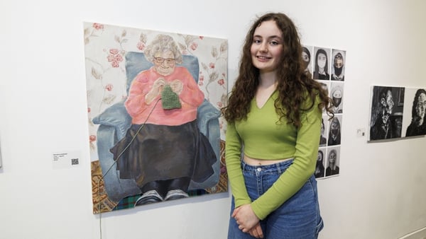 Lucy Young (19) from Omagh with her painting of her grandmother at the This is Art! exhibition