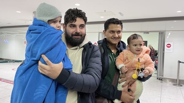 Children Ali and Sara El Estal were reunited with their father Khalid (L) and uncle Mohammad