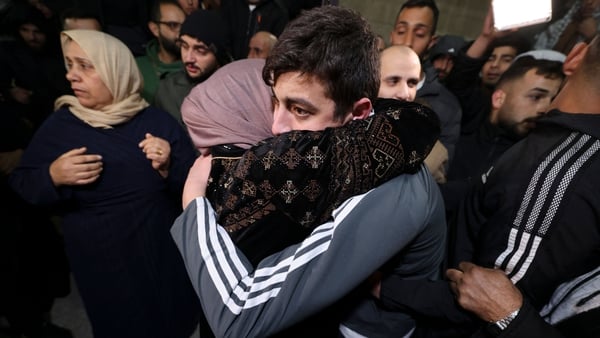 Palestinian Khalil Zama' (R) hugs his mother after being released from an Israeli jail