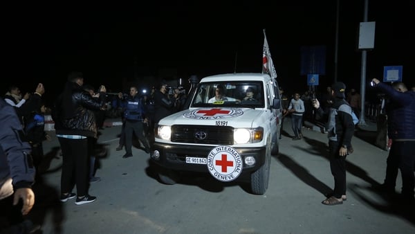 Prisoners handed over to Red Cross officials by Hamas are taken through the Rafah crossing