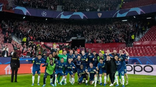 PSV Eindhoven players celebrate their progress in front of the travelling support in Spain